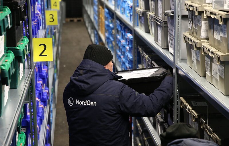 Person shelving container inside Svalbard Global Seed Vault