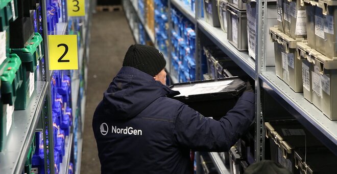 Person shelving container inside Svalbard Global Seed Vault